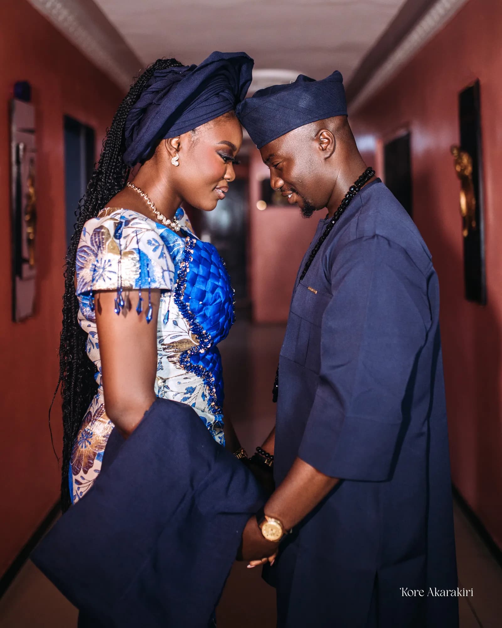 Akorede and Olamilekan in a warm traditional wedding portrait
